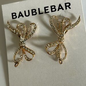 BAUBLEBAR  rhinestone bow earrings in Gold.